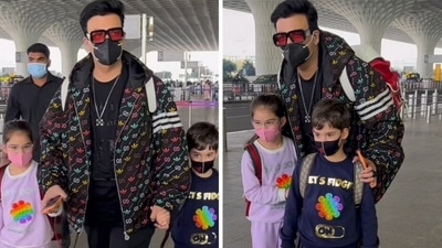 Karan Johar with children Roohi and Yash at airport. Karan Johar with children Roohi and Yash at airport.
