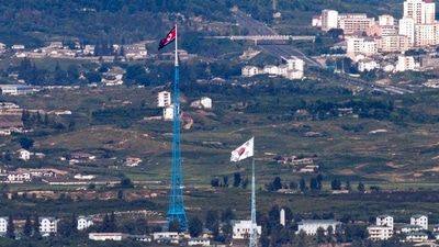 South Korea: Flags of North Korea, rear, and South Korea, front, flutter in the wind. (AP)