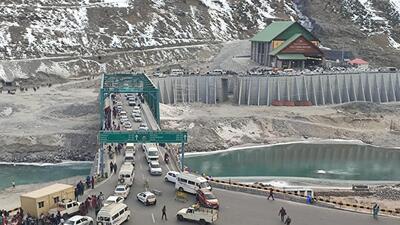 Vehicles seen outside the north portal of the Atal Tunnel in Himachal Pradesh on Monday. (HT Photo) Vehicles seen outside the north portal of the Atal Tunnel in Himachal Pradesh on Monday. (HT Photo)