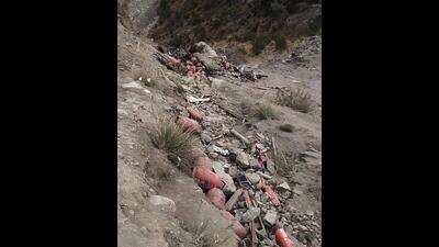 Wrecked remains of the truck in Ramban on Monday. Two persons were killed during the road accident. (ANI)