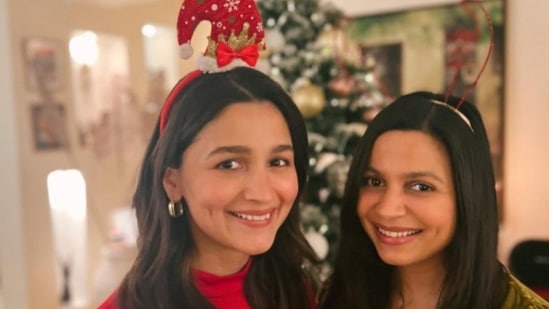 Alia Bhatt and her sister Shaheen Bhatt accessorised themselves with Christmas-themed head gear and struck a pose for the camera with smiles on their faces.&nbsp;(Instagram/@aliaabhatt)
