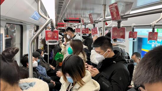 Commuters ride a subway train during the morning rush hour amid the coronavirus disease (Covid-19) outbreak, in Shanghai, on Monday. (REUTERS)