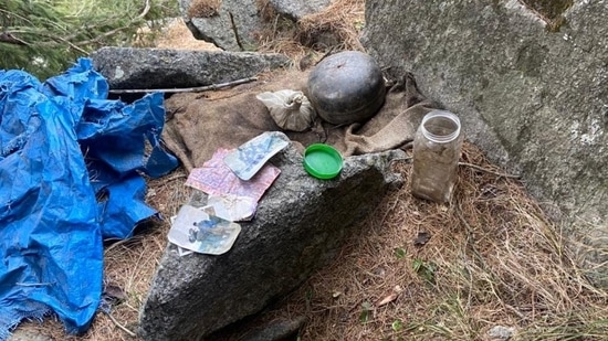 Police detained a suspect after they recovered IED-like material weighing around 15 kg in cylindrical shape, 300-400 gms of RDX, seven 7.62mm cartridges,5 detonators,1 coded sheet, one letter pad page of banned terrorist organisation LET in Basantgarh area of Udhampur.(ANI)