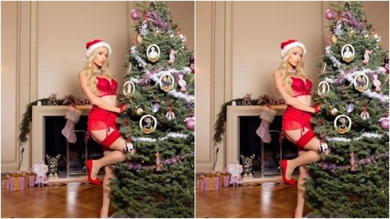 Paris further accessorised her look for the day in classic red stilettos and a statement silver neck choker. For multiple pictures, she can be seen wearing a Christmas cap or carrying a Hello Kitty prop. (Instagram/@parishilton)