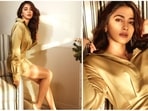 Pooja Hegde once again set the internet ablaze with her gorgeous photos. For a latest photoshoot, the Radhe Shyam actor donned a golden satin dress paired with minimal jewellery. (Instagram/@hegdepooja)