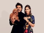 Ram Charan poses with his wife Upasana and their pet dog. Ram Charan poses with his wife Upasana and their pet dog.