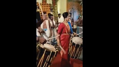 Kerala bride enthusiastically plays chenda. (Instagram/@LHBCoach) Kerala bride enthusiastically plays chenda. (Instagram/@LHBCoach)
