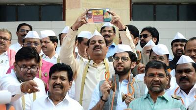 Shiv Sena (Uddhav Balasaheb Thackeray) and Nationalist Congress Party lawmakers outside Maharashtra assembly in Nagpur on Tuesday. (ANI) Shiv Sena (Uddhav Balasaheb Thackeray) and Nationalist Congress Party lawmakers outside Maharashtra assembly in Nagpur on Tuesday. (ANI)