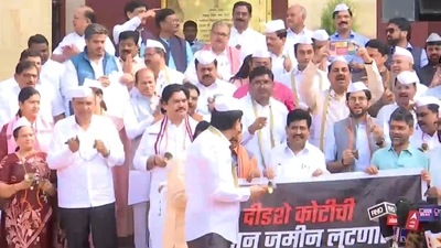 Maharashtra opposition leaders ring bells and sing folk songs on Tuesday to protest against the state government. (Screengrab/ANI video)
