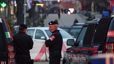 Members of the Italian Carabinieri, part of NATO peacekeepers mission in Kosovo, stand guard at River Ibar Bridge, in the ethnically-divided town of Mitrovica, Kosovo, on Tuesday. (REUTERS)