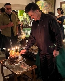 Actor Jackie Shroff looks on as Anil Kapoor cut his birthday cake. Actor Jackie Shroff looks on as Anil Kapoor cut his birthday cake.