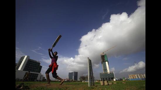 Far from the playing fields of England: A game of cricket on a sunny day at the Bandra-Kurla Complex, Mumbai. (Kalpak Pathak/Hindustan Times)
