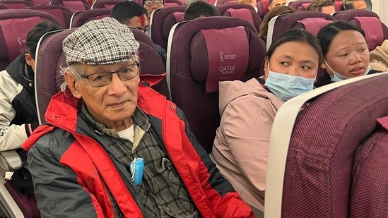 French serial killer Charles Sobhraj sits in an aircraft from Kathmandu to France on Friday. (AFP)