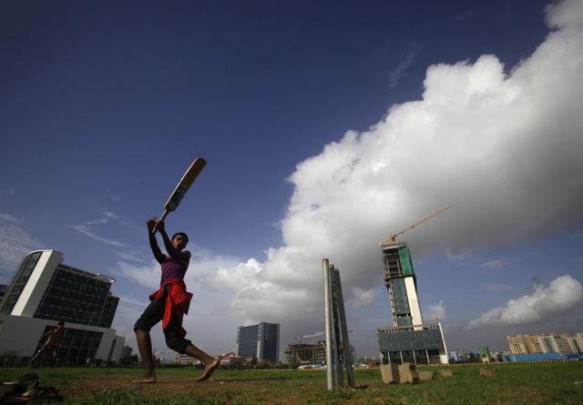 Far from the playing fields of England: A game of cricket on a sunny day at the Bandra-Kurla Complex, Mumbai. (Kalpak Pathak/Hindustan Times) Far from the playing fields of England: A game of cricket on a sunny day at the Bandra-Kurla Complex, Mumbai. (Kalpak Pathak/Hindustan Times)
