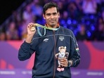 Sharath Kamal Achanta holds up his gold medal after defeating Liam Pitchford of England in the men's singles table tennis final at the Commonwealth Games in Birmingham(AP) Sharath Kamal Achanta holds up his gold medal after defeating Liam Pitchford of England in the men's singles table tennis final at the Commonwealth Games in Birmingham(AP)