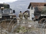 US soldiers serving in NATO-led peacekeeping force KFOR, guard a checkpoint on the road near the northern Kosovo border crossing of Jarinje, along the Kosovo-Serbia border, Kosovo.
