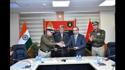 (From left) BSF additional director general PV Rama Sastry, PU vice-chancellor Raj Kumar, PU registrar YP Verma, and BSF inspector general Mridul Sonowal signing the MoU.