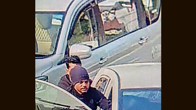 A CCTV grab of two men pushing the snatched vehicle in Mauli Jagran, Chandigarh.