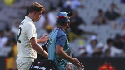 Australia's Cameron Green walks from the field after injuring his finger during the second cricket test between South Africa and Australia at the Melbourne Cricket Ground, Australia, Tuesday, Dec. 27, 2022. (AP Photo/Asanka Brendon Ratnayake) (AP) Australia's Cameron Green walks from the field after injuring his finger during the second cricket test between South Africa and Australia at the Melbourne Cricket Ground, Australia, Tuesday, Dec. 27, 2022. (AP Photo/Asanka Brendon Ratnayake) (AP)