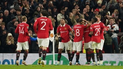 Manchester United's Marcus Rashford, third right, is mobbed by his teammates after scoring his sides second goal during the English League Cup 4th round soccer match between Manchester United and Burnley, at Old Trafford in Manchester, England Wednesday, Dec. 21, 2022. (AP Photo/Dave Thompson) (AP) Manchester United's Marcus Rashford, third right, is mobbed by his teammates after scoring his sides second goal during the English League Cup 4th round soccer match between Manchester United and Burnley, at Old Trafford in Manchester, England Wednesday, Dec. 21, 2022. (AP Photo/Dave Thompson) (AP)