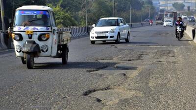 Commuters making their way through a pothole-riddled stretch on the Southern Bypass in Ludhiana. (Harvinder Singh/HT) Commuters making their way through a pothole-riddled stretch on the Southern Bypass in Ludhiana. (Harvinder Singh/HT)