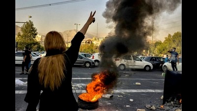In a picture dated October 1, 2022, Iranians protest the death of 22-year-old Mahsa Amini after she was detained by the morality police, in Tehran. (AP Photo//Middle East Images, File)