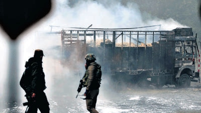 Security personnel during an encounter with terrorists at the Sidhra area in Jammu. (PTI) Security personnel during an encounter with terrorists at the Sidhra area in Jammu. (PTI)