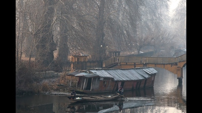 Boatmen rowing their boat on a cold winter day in Srinagar on Wednesday. The minimum temperature dropped to season’s lowest in southern resort of Pahalgam while Gulmarg in north Kashmir shivered at -6°C. (ANI) Boatmen rowing their boat on a cold winter day in Srinagar on Wednesday. The minimum temperature dropped to season’s lowest in southern resort of Pahalgam while Gulmarg in north Kashmir shivered at -6°C. (ANI)