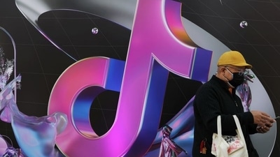A man stands near a giant sign of Chinese company ByteDance's app TikTok. REUTERS/Tingshu Wang/File Photo (REUTERS)
