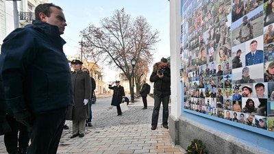 Russia-Ukraine War: French Armies Minister Sebastien Lecornu stands in attention after laying a wreath in front of the Memorial Wall of Fallen Defenders of Ukraine. (AFP) Russia-Ukraine War: French Armies Minister Sebastien Lecornu stands in attention after laying a wreath in front of the Memorial Wall of Fallen Defenders of Ukraine. (AFP)