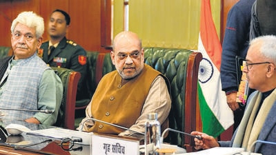Union home minister Amit Shah with J&K LG Manoj Sinha and others during a meeting, in New Delhi on Wednesday. (PTI) Union home minister Amit Shah with J&K LG Manoj Sinha and others during a meeting, in New Delhi on Wednesday. (PTI)