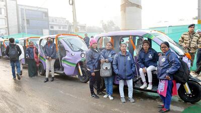 Women drivers standing next to e-autos during the launch of last mile connectivity to DMRC metro stations (HT Photo) Women drivers standing next to e-autos during the launch of last mile connectivity to DMRC metro stations (HT Photo)