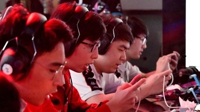 The Indian team battles against Laos at the eSports "Arena of Valor" tournament as a exhibition sport at the 2018 Asian Games. (AFP)