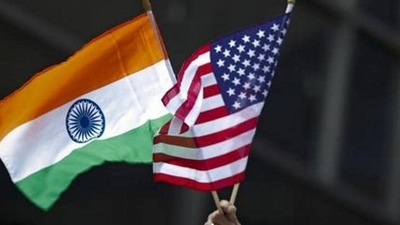 India-US Relations: A man holds the flags of India and the US flag in New York. (Reuters) India-US Relations: A man holds the flags of India and the US flag in New York. (Reuters)