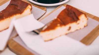 Vasilopita, Greece: This is a traditional Greek cake served at midnight on new year's eve to celebrate Saint Basil. A gold coin wrapped in foil is hidden inside the cake and whoever gets the coin in their slice is said to have good luck for the rest of the year. (Unsplash) Vasilopita, Greece: This is a traditional Greek cake served at midnight on new year's eve to celebrate Saint Basil. A gold coin wrapped in foil is hidden inside the cake and whoever gets the coin in their slice is said to have good luck for the rest of the year. (Unsplash)