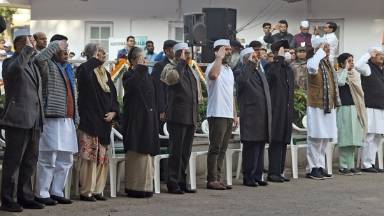 Congress Parliamentary Party chairperson Sonia Gandhi with party leaders Rahul Gandhi, Ambika Soni, Mani Shankar Aiyar and JP Aggarwal and others stand for the National Anthem at the party's 138th Foundation Day celebrations at AICC office in New Delhi.(ANI)