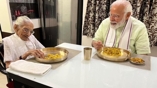 PM Modi having food with mother Heeraben Modi in June 2022.(ANI)