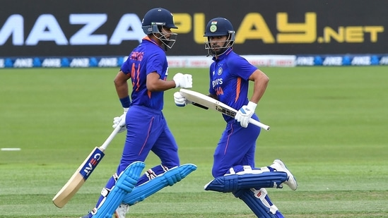 India's Shikhar Dhawan (R) and Shreyas Iyer run between the wickets during the third and final one-day international cricket match between New Zealand and India at Hagley Oval in Christchurch on November 30, 2022. (Photo by Sanka Vidanagama / AFP) (AFP)
