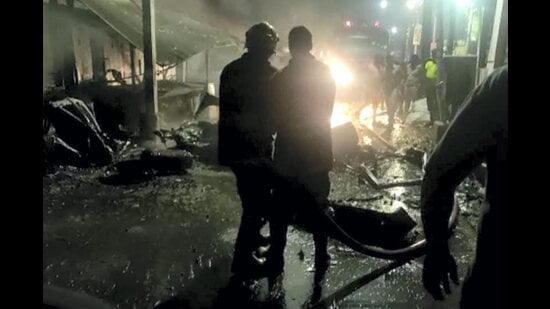 Coimbatore: Emergency services personnel at the site after an LPG cylinder exploded inside a car, in Coimbatore, Sunday, Oct. 23, 2022. One person was charred to death in the incident. (PTI Photo)(PTI10_23_2022_000181A) (PTI)