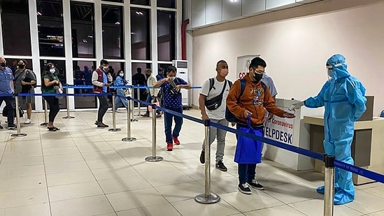 Passengers undergo thermal screening as random Covid-19 testing starts at various airports across the country in the wake of rising cases of Coronavirus globally. (PTI) Passengers undergo thermal screening as random Covid-19 testing starts at various airports across the country in the wake of rising cases of Coronavirus globally. (PTI)