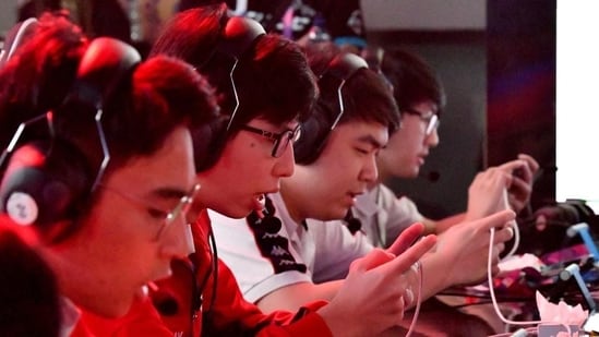 The Indian team battles against Laos at the eSports "Arena of Valor" tournament as a exhibition sport at the 2018 Asian Games.(AFP)