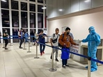 Passengers undergo thermal screening as random Covid-19 testing starts at various airports across the country in the wake of rising cases of Coronavirus globally. (PTI) Passengers undergo thermal screening as random Covid-19 testing starts at various airports across the country in the wake of rising cases of Coronavirus globally. (PTI)