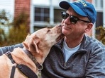 Dogs may lick their owners for a variety of reasons, and it's not always easy to determine why a particular dog is licking at a particular time(Pexels) Dogs may lick their owners for a variety of reasons, and it's not always easy to determine why a particular dog is licking at a particular time(Pexels)