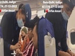 The 45-second video clip, shared on Twitter, shows two flight attendants tending to a passenger who injured his finger. (Twitter) The 45-second video clip, shared on Twitter, shows two flight attendants tending to a passenger who injured his finger. (Twitter)