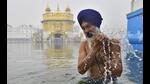 A devotee braving the chill to take a dip at Golden Temple in Amritsar on the birth anniversary of the 10th Sikh Guru, Guru Gobind Singh, on Thursday. (Sameer Sehgal/HT) A devotee braving the chill to take a dip at Golden Temple in Amritsar on the birth anniversary of the 10th Sikh Guru, Guru Gobind Singh, on Thursday. (Sameer Sehgal/HT)