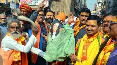 Akhil Bharatiya Hindu Mahasabha members burn posters of Pathaan film in Mathura.                   (ANI)