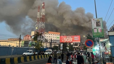 In a video shared by Cambodia's firefighting agency on social media, onlookers could be heard shouting pleas to rescue people trapped on the roof of the hotel complex, which is more than a dozen stories tall at its highest point. The video showed at least one man falling as the flames reached the roof.&nbsp; (AFP)