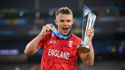 England's Sam Curran celebrates winning the T20 World Cup with the trophy. (AAP Image via REUTERS)