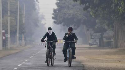 Students riding bicycles amid early-morning fog in Ludhiana. (Gurpreet Singh/HT) Students riding bicycles amid early-morning fog in Ludhiana. (Gurpreet Singh/HT)