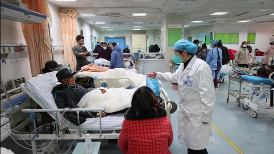 A medical worker attends to a patient at the emergency department of Ganyu District People's Hospital, amid the coronavirus disease (Covid-19) outbreak in Lianyungang, Jiangsu province, China. (VIA REUTERS)